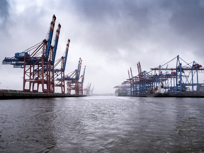 Feeder vessel at port during departure operations.